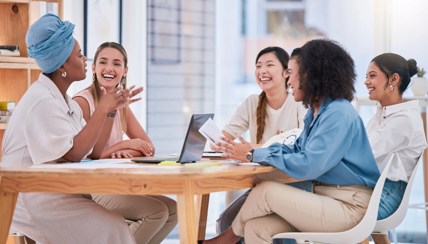Business team, empowerment and female meeting in casual work environment. trust, collaboration and diversity in an inclusive company. coaching, motivation and positive woman working in leadership.